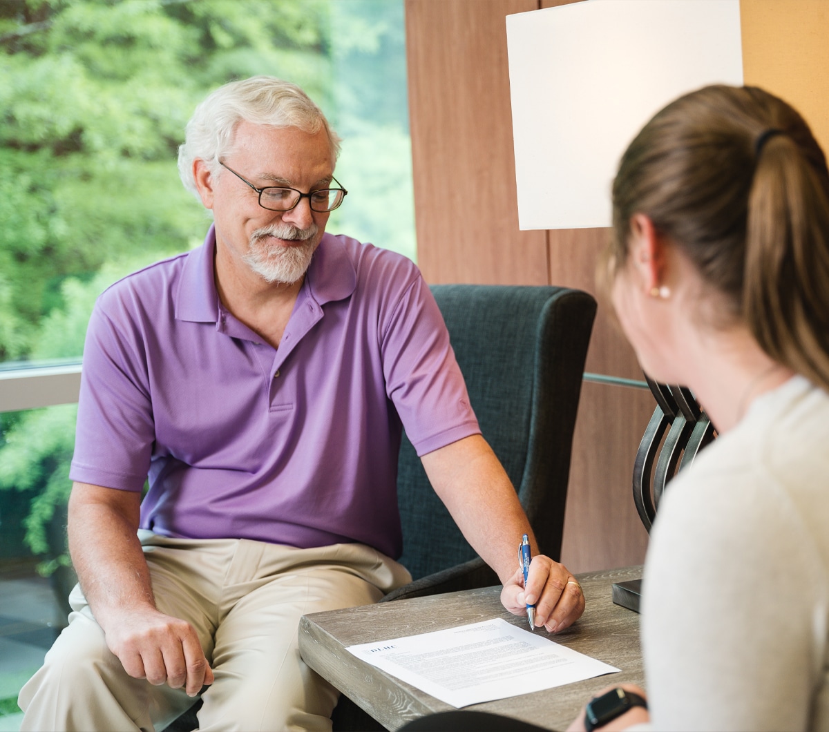 a man and a woman sitting on a table